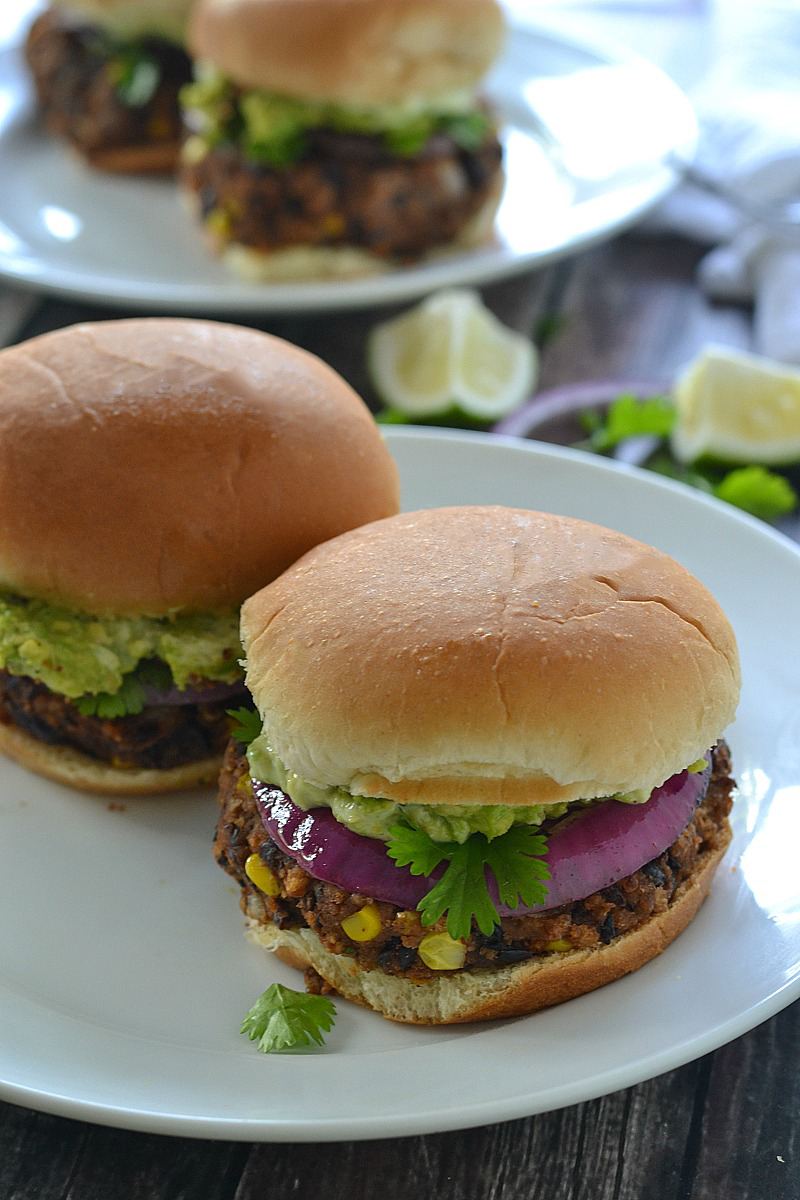 Black Bean Sliders/Burgers topped with a creamy avocado mayo, smashed avocado and red onion - so good! | www.motherthyme.com