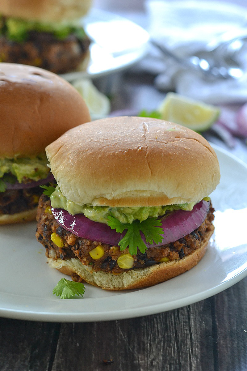 Black Bean Sliders/Burgers topped with a creamy avocado mayo, smashed avocado and red onion - so good! | www.motherthyme.com