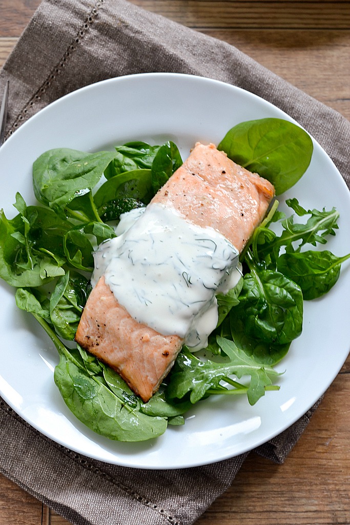 An easy recipe for Baked Lemon Pepper Salmon topped with a Creamy Dill Sauce ready in 30 minutes