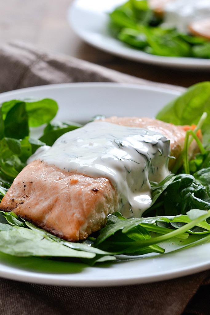 An easy recipe for Baked Lemon Pepper Salmon topped with a Creamy Dill Sauce ready in 30 minutes