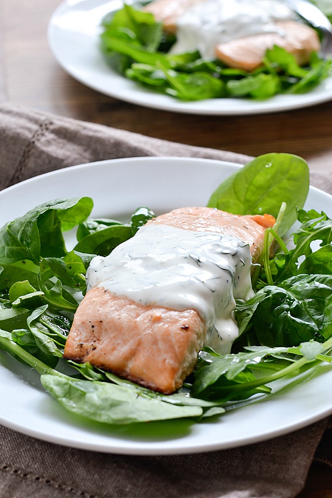 An easy recipe for Baked Lemon Pepper Salmon topped with a Creamy Dill Sauce ready in 30 minutes.