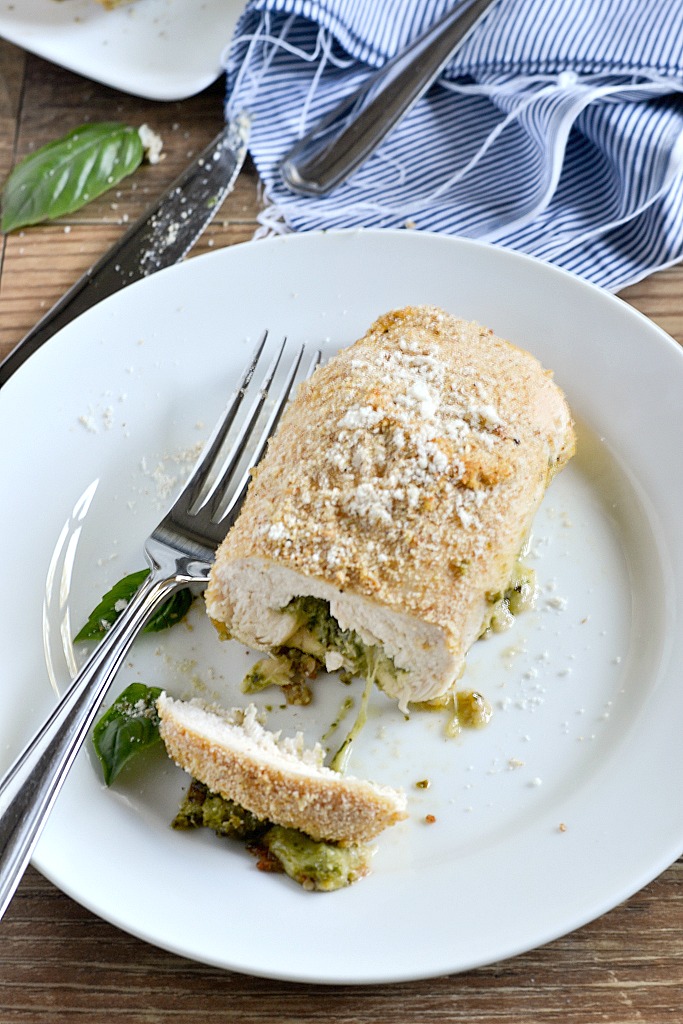 An easy recipe for Pesto Chicken Roll-Ups filled with fresh basil pesto and shredded mozzarella cheese then rolled up and coated with breadcrumbs for a delicious meal that is simple to make and yummy to eat.