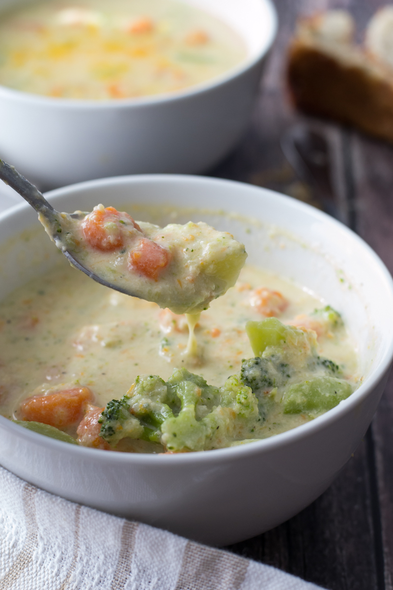 Warm up to a bowl of Broccoli Cheese Soup made with a blend of cheeses that is easy to make and ready in about 30 minutes.