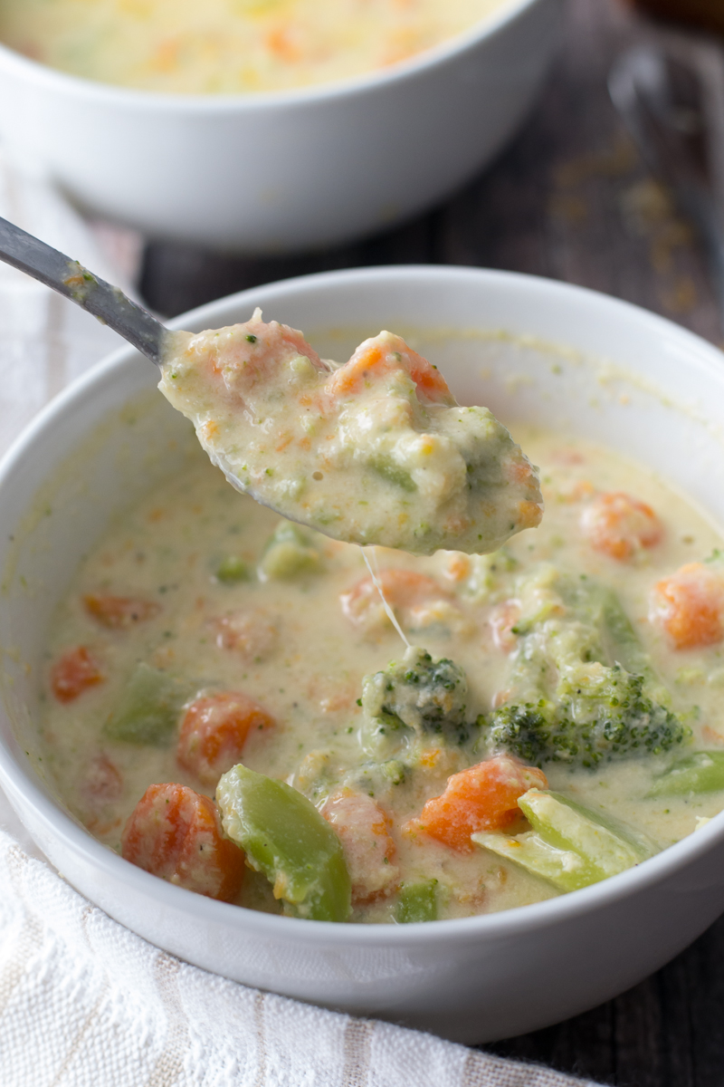 Warm up to a bowl of Broccoli Cheese Soup made with a blend of cheeses that is easy to make and ready in about 30 minutes.